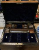 A Victorian burr walnut and mother of pearl inlaid travelling vanity case,