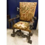 An 18th Century Continental oak framed hall chair or throne chair with long stitch needlework