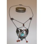 A Art Nouveau style white metal mounted coral bead and abalone shell embellished pendant of foliate