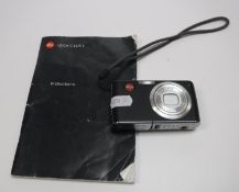 A Leica C-Lux I camera with leather case and instruction manual