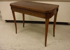 An early 19th Century rosewood and cross-banded fold-over card table on square tapered splayed