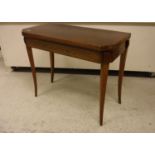 An early 19th Century rosewood and cross-banded fold-over card table on square tapered splayed