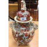 A pair of circa 1900 Japanese Satsuma ware vases and covers with all-over figural decoration and