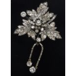 A Belle Epoque style diamond encrusted flowerhead brooch, the centre stone approx. .