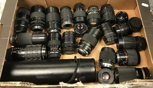 A box containing 22 various camera lenses including a Sigma Super Tele multi-coated 1:5.