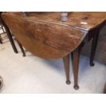 A 19th Century oak dining table, the oval drop-leaf top over a single end drawer,