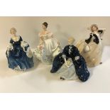 A collection of Royal Doulton figures comprising "Autumn Breezes" (HN2147), "Lucy" (HN3653),