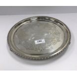 A George V silver salver, the centre field inscribed “Presented to William Barton Esq.