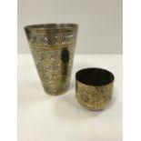 An Indian silvered brass and engraved goblet with Sanskrit decoration, 11 cm high,