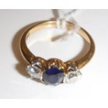 An 18 carat gold mounted ladies dress ring set with central oval cut sapphire, approx .