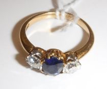 An 18 carat gold mounted ladies dress ring set with central oval cut sapphire, approx .