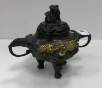 A Chinese censer with bronze and brass highlights,