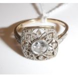 A 14 carat yellow and white gold mounted filigree design dress ring of rounded square form,