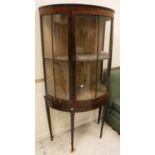 A 19th Century rosewood veneered display cabinet of demilune form,