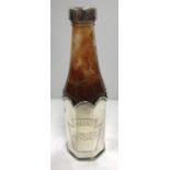 A Theo Fennell silver Heinz Tomato Ketchup bottle holder (marked for Theo Fennell London 2000 and