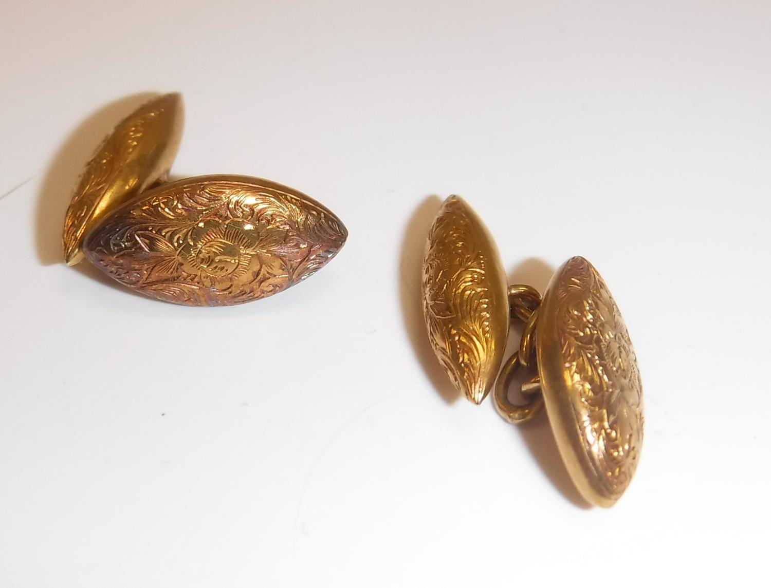 A pair of Victorian 15 carat gold engraved cufflinks of navete form, 4.
