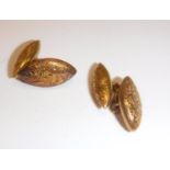 A pair of Victorian 15 carat gold engraved cufflinks of navete form, 4.