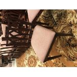 A set of twelve Indian carved hardwood framed dining chairs in the George III manner,