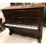 An early 20th Century rosewood cased upright piano,