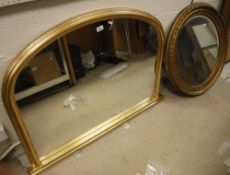 A modern gilt framed dome topped over mantel mirror in the Victorian style 113 cm wide x 81 cm high
