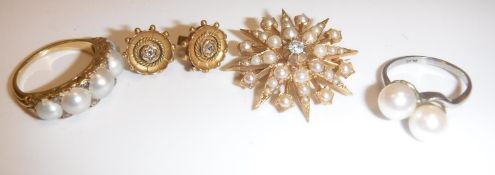 A gold mounted seed pearl starburst brooch with central diamond, approx. .1 carat, 4.