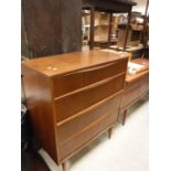 An Austinsuite teak chest of four long drawers on turned legs 79.