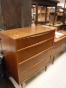 An Austinsuite teak chest of four long drawers on turned legs 79.