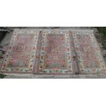 A set of three Chinese rugs,