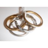 A 22 carat gold wedding band, 2.4 g, size I, a plain platinum wedding band, 1.
