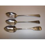 Two 19th Century silver Old English pattern serving spoons and a fiddle pattern serving spoon,