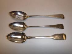 Two 19th Century silver Old English pattern serving spoons and a fiddle pattern serving spoon,