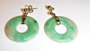 A pair of modern jade and yellow metal mounted disc earrings - diameter of disc approx. 2.