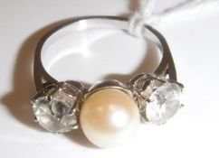 A white gold mounted (un-marked) pearl and white sapphire dress ring,