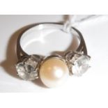 A white gold mounted (un-marked) pearl and white sapphire dress ring,