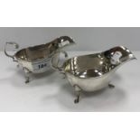 A pair of silver sauceboats, raised on hoof feet (by Charles S Green & Co. Ltd, Birmingham 1945), 6.