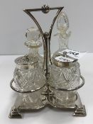A silver mounted cut glass four-piece cruet by Roberts & Belk of Sheffield