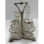 A silver mounted cut glass four-piece cruet by Roberts & Belk of Sheffield