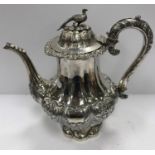 A Victorian silver teapot of squash form with engraved decoration,