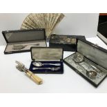 A collection of silver and silver plate cutlery to include a cased continetal white metal serving