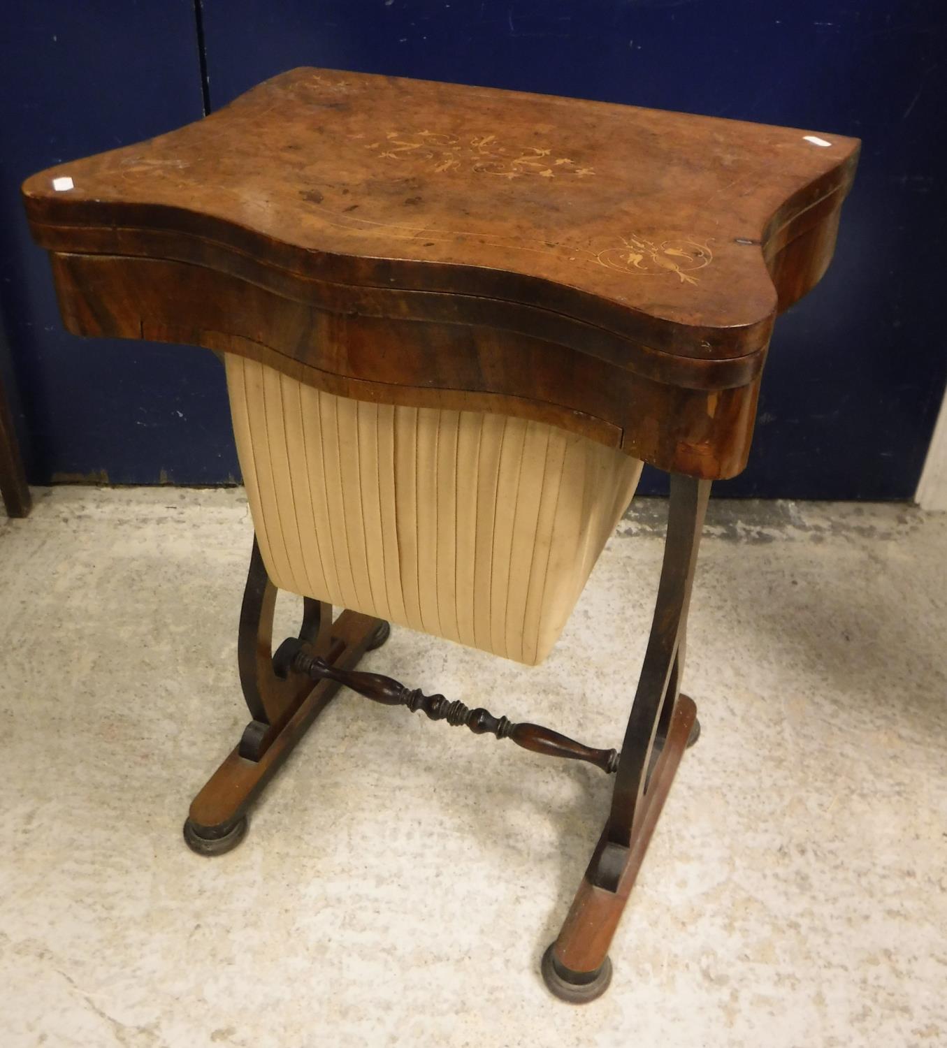 A Victorian burr walnut and marquetry inlaid serpentine fronted work table,