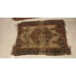 A 20th Century Persian rug with all-over floral medallion decoration on a blue ground,