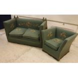 An early 20th Century green upholstered and floral spray needlework decorated knowle sofa of