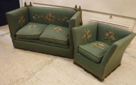 An early 20th Century green upholstered and floral spray needlework decorated knowle sofa of