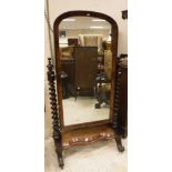 A Victorian mahogany cheval mirror, the domed plate on barley-twist supports to platform base,