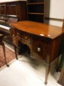 A small 20th Century mahogany sideboard in the Sheraton Revival taste,