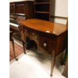 A small 20th Century mahogany sideboard in the Sheraton Revival taste,