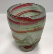 A Siddy Langley wrythen glass vase in white, red, green and yellow with silver foil inclusions,