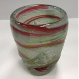 A Siddy Langley wrythen glass vase in white, red, green and yellow with silver foil inclusions,