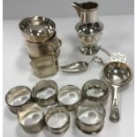 A collection of eight silver napkin rings (various styles, makers and dates),