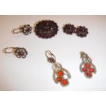 A Victorian garnet brooch set with numerous cut stones, 2.8 cm x 2.